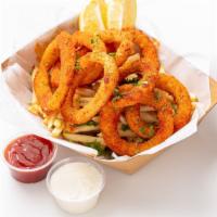 Fried Calamari Basket · Crunch fried calamari rings seasoned with house blended cajun seasoning served with french f...