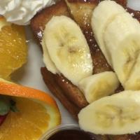 French Toast · Served with seasonal fruit.