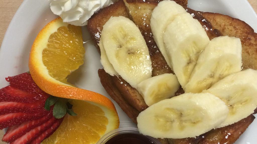 French Toast · Served with seasonal fruit.