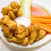 Cauliflower Bites · Cauliflower bites, fried in our housemade vegan beer-batter, served with our 6740 wing sauce...