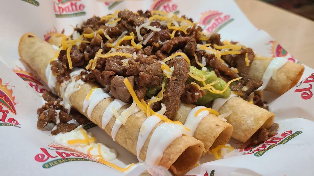 Loaded Taquitos · Five beef taquitos topped with sour cream, guacamole, cheese & Carne Asada.