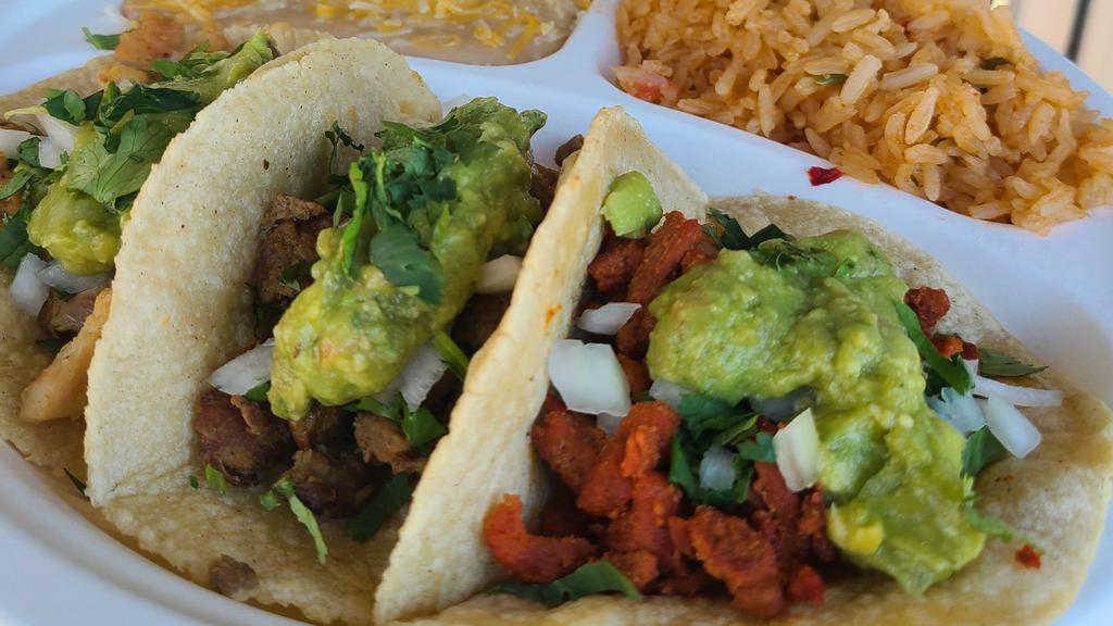 Los Tres Amigos · Three mini tacos made with handmade tortillas, your choice of meat, onion, cilantro, guacamole & salsa verde. Served with a side of rice & beans.