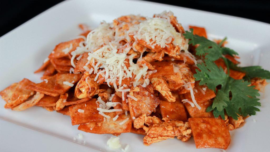 Chilaquiles Rojos O Verdes · Lightly fried tortilla chips cooked with eggs, red or green hot sauce & topped sour cream, cheese. Served with rice & beans