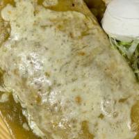 Oven Burrito Deluxe · Pork, chicken or shredded beef with beans, topped with verde, red or ranchera sauce and melt...
