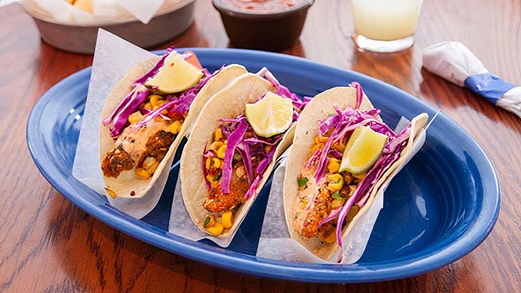 3 Original Fish Tacos · Tortilla encrusted fish, roasted corn salsa, shredded red cabbage and chipotle aioli on white corn tortillas.