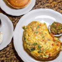 Santa Fe Omelette · Zesty Southwestern omelette with a medley of fresh onions, cilantro, tomatoes, and jalapeño ...