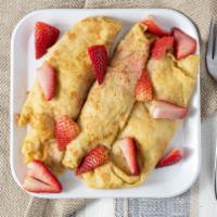 Fresh French Strawberry Crepes · Richard’s favorite. Crepes are wrapped around fresh juicy strawberries, topped with tropical...