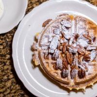 Georgia Pecan Waffle · Tender pecans cooked inside; topped with powdered sugar and yes, more pecans.