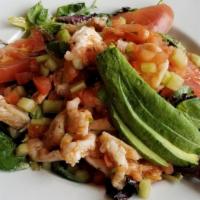 Ceviche Salad · Mixed green salad with cilantro lime dressing topped with shrimp and fish cooked in lime jui...