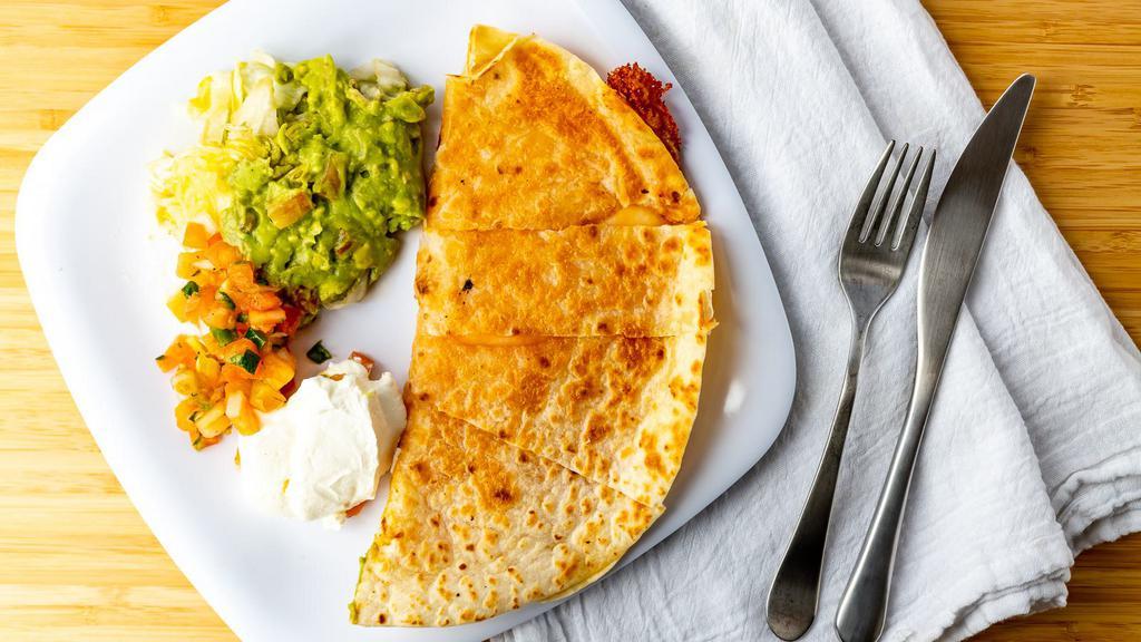 Mexquite Quesadilla · Mexquite favorites. Flour tortilla with melted cheddar and jack cheese served with guacamole, sour cream, iceberg lettuce, and pico de gallo.