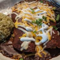 Mole Enchiladas · Two chicken enchiladas topped with our house mole sauce, green onions and sour cream served ...