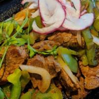 Fajitas De Pollo (Chicken Fajitas) · Mexquite favorites. Marinated chicken breast sautéed with green bell peppers and onions serv...