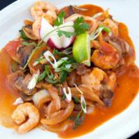 Huachinango · Fish and shrimp sautéed with mushrooms, jalapenos, onions and tomato sauce served with cilan...