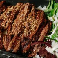  Teriyaki Beef Don · Grilled beef, served over steamed white rice and side salad topped with broccoli.