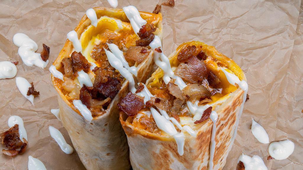 The Hangover Breakfast Burrito · 3 eggs, smoked bacon, haus chili, white American cheese, crispy tater tots, and mayonnaise. Sides of mayonnaise and hot sauce.