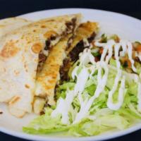 Quesadilla · Choice of meat, shredded cheese, side of pico de gallo, lettuce.