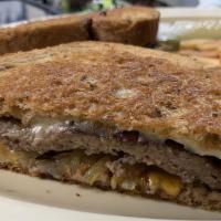 Patty Melt · A juicy third pounder with melted american and swiss cheese grilled onions on grilled rye br...