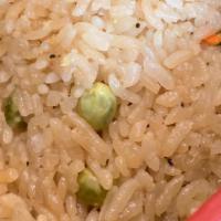Fried Rice · Savory seasoned white rice with peas and carrots