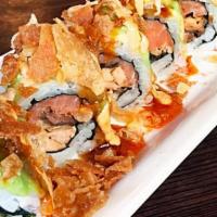 Salmon Overload Roll · IN:  Salmon Skin, Smoked Salmon and Gobo Carrot
Top: Avocado, Spicy Sauce, Spicy Mayo, Sweet...