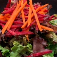 House Salad · Spring Mix Salad topped w/ shredded Carrots & Beets, served with our famous House Dressi...