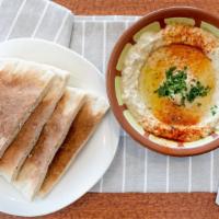 Hummus · Chickpeas, tahini, garlic, lemon & olive oil served with bread