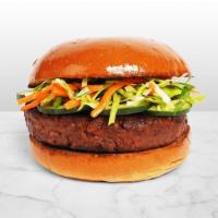 The Bahn Mi · Angus beef patty with shredded carrot slaw, cilantro, sliced jalapenos, cucumber, and srirac...
