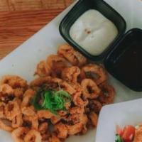 Ika Ring · Crispy calamari rings served with a sweet and spicy sauce and garlic aioli.