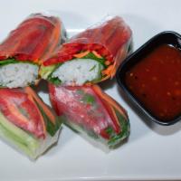 Vegan Spring Rolls · Carrots, cucumber, spinach, red bell pepper and cilantro served with sweet and sour chili sa...