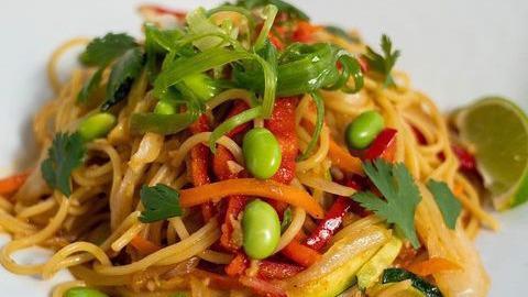 Stir Fry Pasta · Edamame, red bell pepper, carrots, onion, zucchinis, chili in sweet-soy sauce, topped with cilantro and scallions.