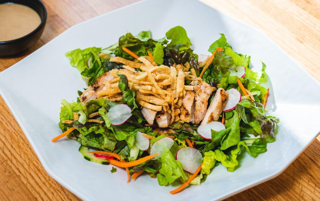 Oriental Chicken Salad · Lettuce, radish, cucumber, carrots with house sesame dressing grilled chicken and wonton strips on top. Ginger, or miso tomato dressing available.