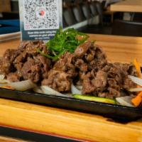 Sukiyaki Style Beef · Thinly sliced marinated sirloin on assorted vegetables. hot pot option is available.