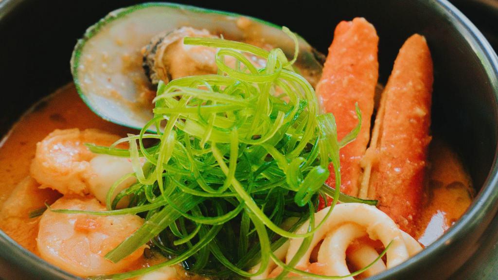 Miso Cioppino · Fresh crab legs, calamari, mussels, prawns and scallops stewed in a tomato miso broth.