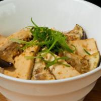 Eggplant & Tofu · Sliced eggplant and tofu sautéed with gluten free soy sauce and garlic.