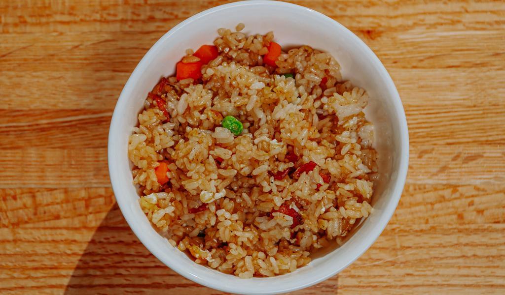 Bacon Fried Rice · Mixed veggies, bacon, egg, butter and soy sauce.