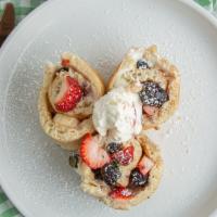 Fruit Roll Pancakes · Three pcs rolled pancakes filled with butter, strawberry, banana and blueberry, topped with ...