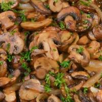 Sautéed Mushrooms · Sliced mushrooms sautéed with garlic, butter, cognac sauce and topped with parsley.