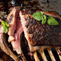 Rack Of Lamb · Herb-marinated tender rack of lamb grilled over an open fire.