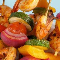 Shrimp Kabob · Marinated tiger shrimp, charbroiled and served with garden salad and white basmati rice.