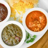 Combination Of 3 Stews · A sample platter of fesenjan, ghormeh sabzi, gheimeh bademjan served with white basmati rice...