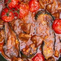 Veggie Gheimeh Bademjan · Vegetarian. Sautéed whole eggplants served in a slow-cooked tomato-based stew, with yellow s...
