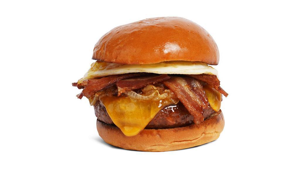 The Morning Glory Burger · Beef patty with crisp bacon, caramelized onions, melted cheddar cheese, mayo, and a fried egg on a fluffy brioche bun.