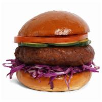 The Vegan Burger · Veggie patty with lettuce, tomato, onion, and pickles on a fluffy brioche bun.