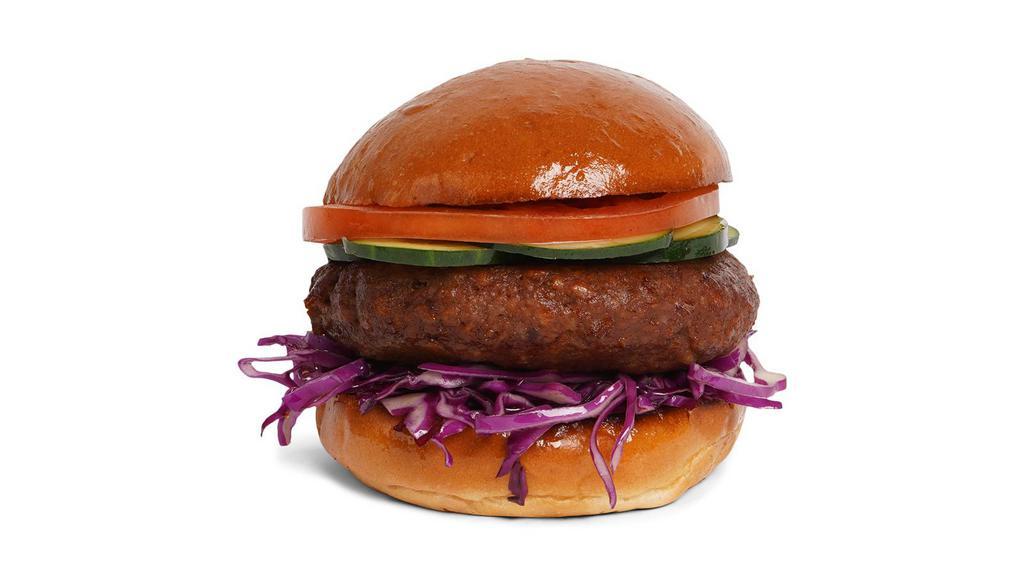 The Vegan Burger · Veggie patty with lettuce, tomato, onion, and pickles on a fluffy brioche bun.
