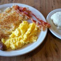 Country Breakfast · Two eggs, one sausage link, two strips of bacon, hash browns and a buttermilk biscuit with h...