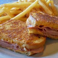 Grilled Ham And Cheese · Thinly sliced ham on grilled sourdough bread with american cheese.