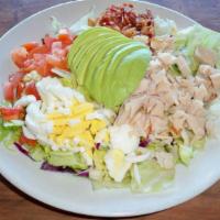 Cobb Salad · Turkey breast, tomato, bacon, fresh avocado and a hard boiled egg. served on a bed of iceber...