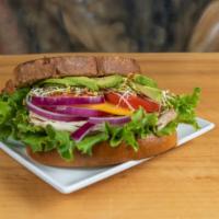 Roasted Turkey · Choice of bread, turkey, cheddar cheese, red onion, sprouts, avocado, tomato, lettuce.