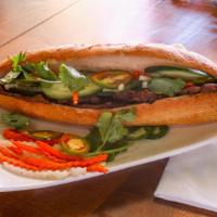 Grilled Pork Banh Mi · Grilled pork, house pickled daikon & carrots, cucumber with mayonnaise and soy sauce in a to...