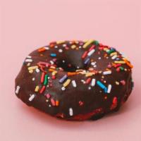 Chocolate Sprinkle Doughnut · Classic chocolate glaze topped with rainbow sprinkles (GF, N)