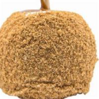 Cheesecake Caramel Apple · A Granny Smith apple covered in fresh caramel, rolled in white confection, topped with crush...